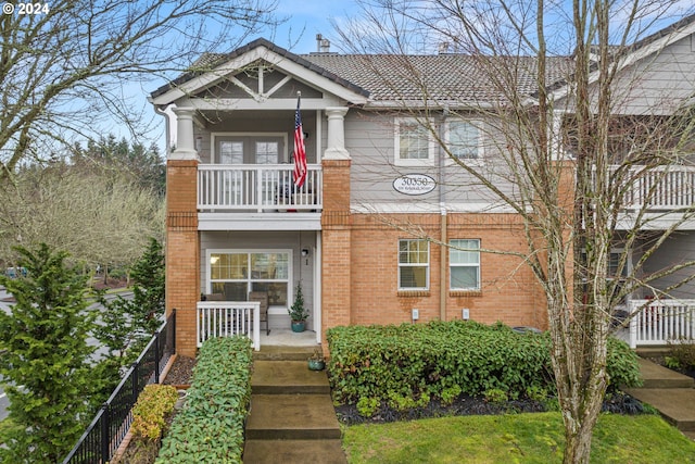 view of front of home with a balcony