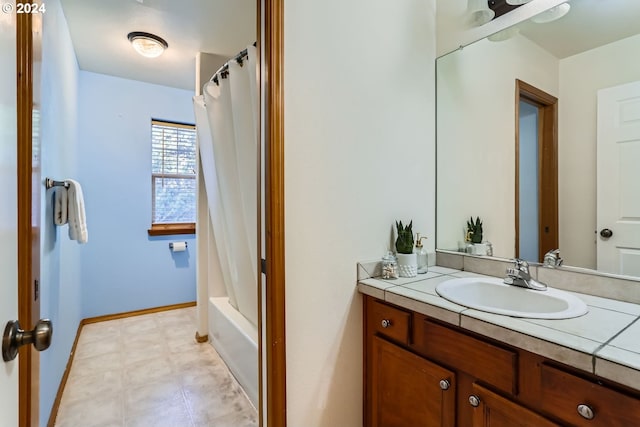 bathroom with vanity and shower / bath combo