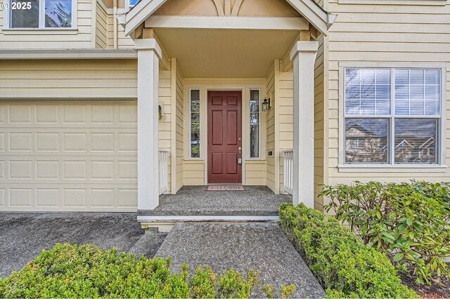 doorway to property featuring a garage