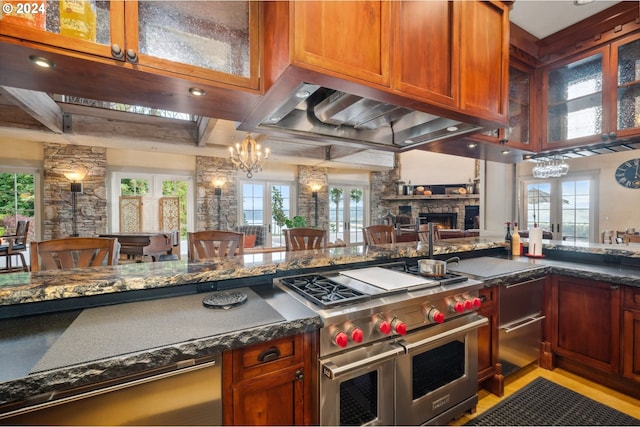 kitchen with double oven range, french doors, and a wealth of natural light