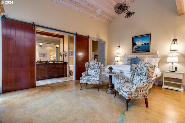 bedroom with wooden ceiling, a barn door, sink, and high vaulted ceiling