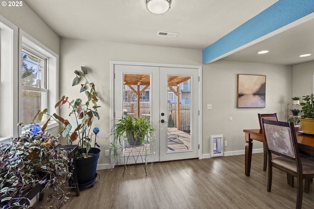 interior space with french doors and wood-type flooring