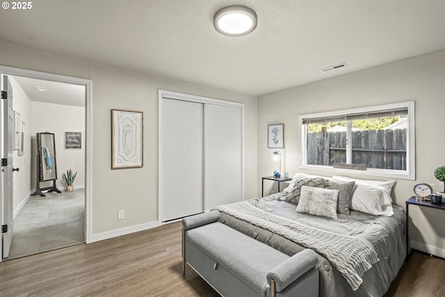 bedroom featuring a closet and hardwood / wood-style flooring