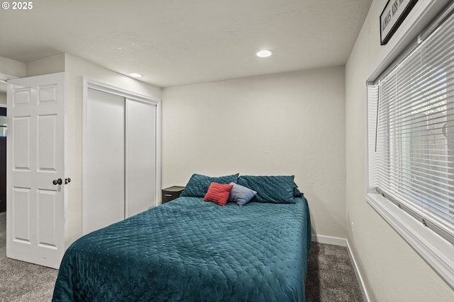 bedroom with a closet and carpet flooring