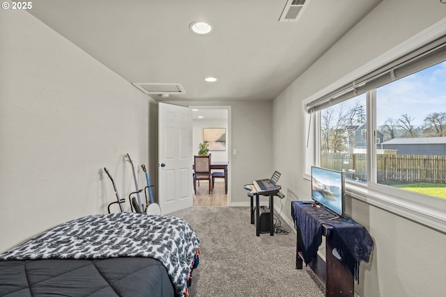 bedroom featuring light carpet