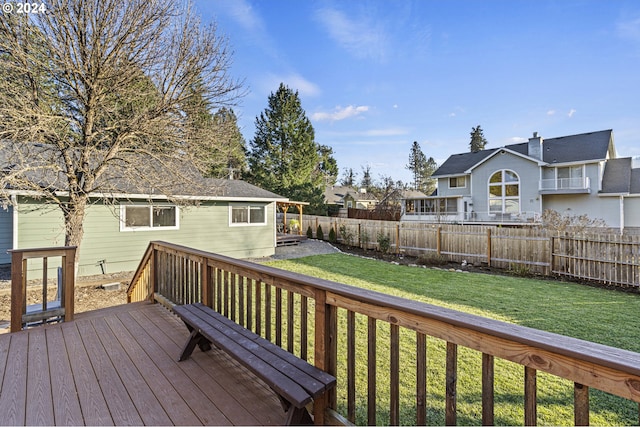 wooden deck with a lawn