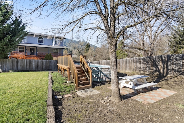 view of yard featuring a deck with mountain view