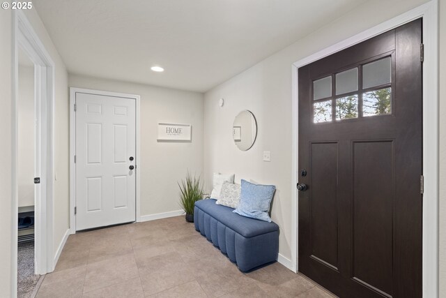 entrance foyer featuring light tile patterned flooring