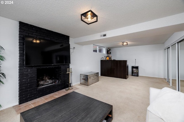 living room featuring carpet flooring, a fireplace, and a textured ceiling