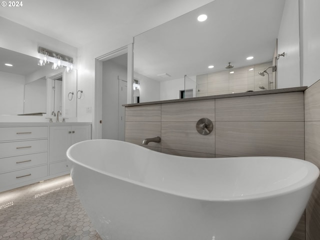 37671 Timber Ln, Astoria, OR 97103 - full bathroom with recessed lighting, vanity, a soaking tub, a tile shower, and tile patterned floors