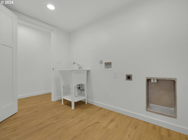 37671 Timber Ln, Astoria, OR 97103 - laundry area with hookup for a washing machine, electric dryer hookup, light wood-type flooring, baseboards, and recessed lighting