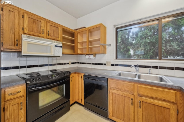 kitchen with decorative backsplash, black appliances, open shelves, and a sink