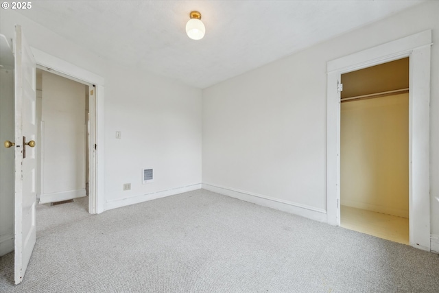 unfurnished bedroom with visible vents and carpet floors