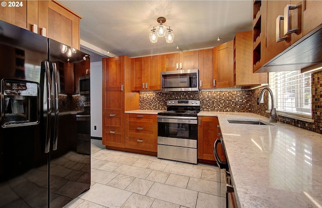 kitchen featuring light tile patterned floors, sink, stainless steel appliances, and decorative backsplash