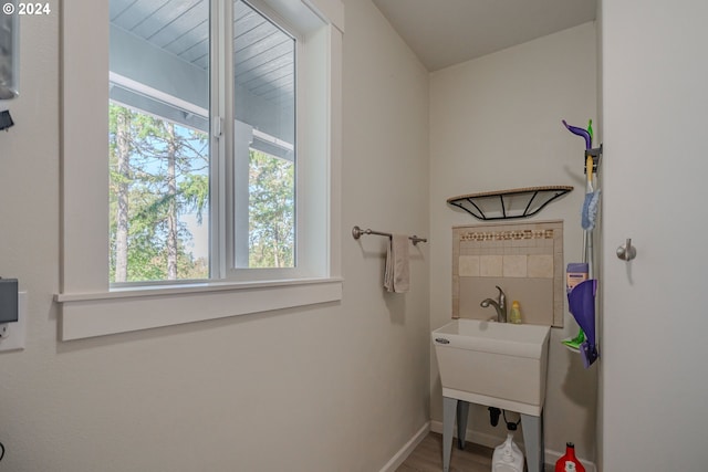 bathroom featuring wood-type flooring, vaulted ceiling, vanity, and ceiling fan