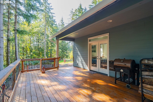 carpeted bedroom featuring ceiling fan, french doors, and access to exterior