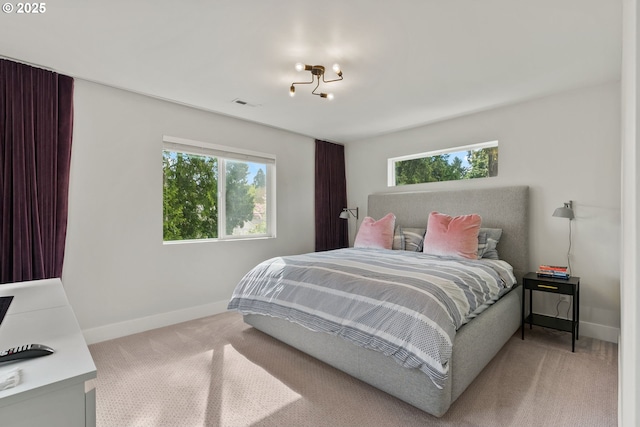 6332 NE 30th Ave, Portland, OR 97211 - carpeted bedroom featuring baseboards and multiple windows