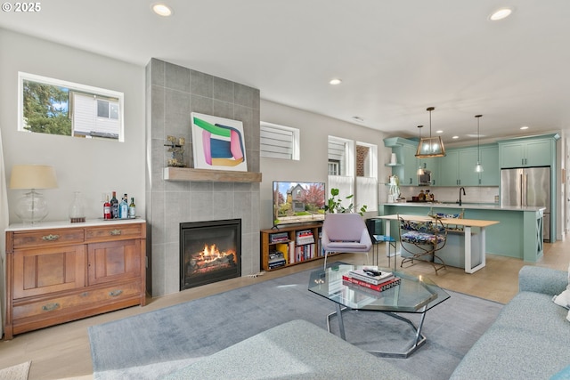 6332 NE 30th Ave, Portland, OR 97211 - living area featuring recessed lighting, a fireplace, and light wood-style flooring