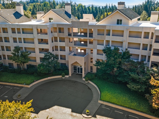 6665 W Burnside Rd Unit 413, Portland, OR 97210 - view of apartment building / complex featuring uncovered parking