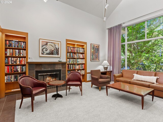 carpeted living room with a paneled ceiling