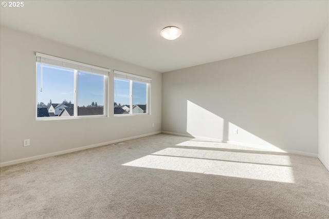 empty room featuring light carpet