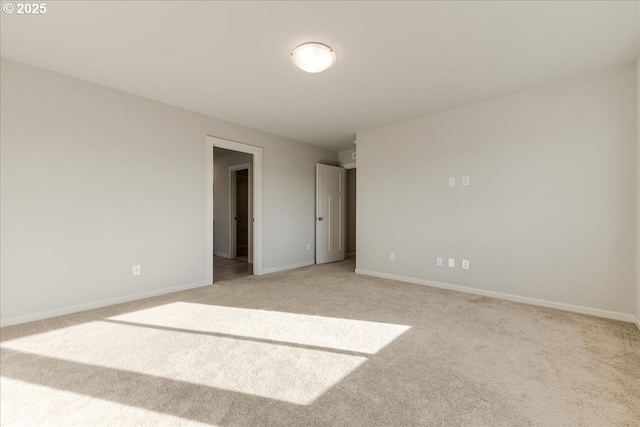 unfurnished bedroom featuring light carpet