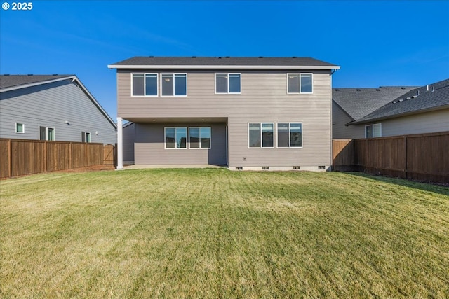 rear view of property with a yard