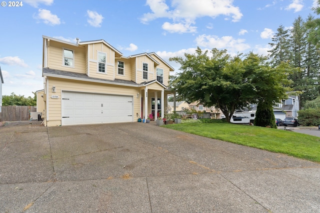 view of front of house featuring a front yard and a garage