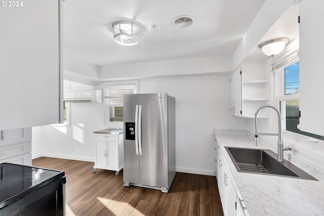 2746 Colorado St, Longview, WA 98632 - kitchen with stainless steel fridge, a sink, dark wood-style floors, and white cabinets