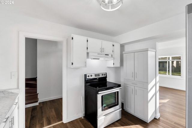 2746 Colorado St, Longview, WA 98632 - kitchen featuring stainless steel electric range, under cabinet range hood, light countertops, dark wood finished floors, and white cabinets