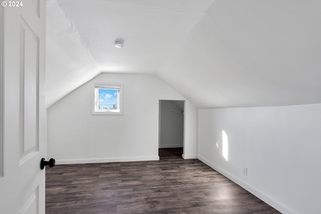 2746 Colorado St, Longview, WA 98632 - bonus room with lofted ceiling, dark wood-style floors, and baseboards