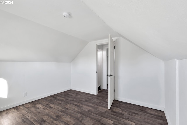 2746 Colorado St, Longview, WA 98632 - additional living space featuring vaulted ceiling, dark wood finished floors, and baseboards