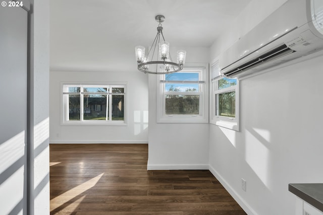2746 Colorado St, Longview, WA 98632 - unfurnished dining area with a wall unit AC, a chandelier, baseboards, and dark wood-style flooring
