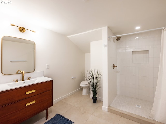 bathroom featuring vanity, tile patterned flooring, curtained shower, and toilet