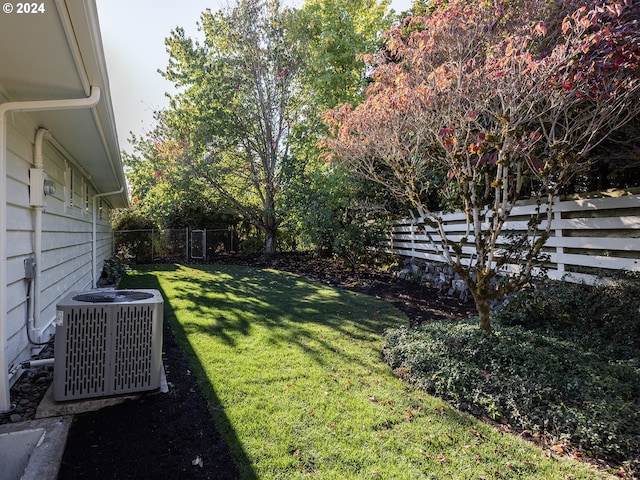 view of yard with central air condition unit