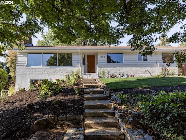 view of front of property with a front lawn