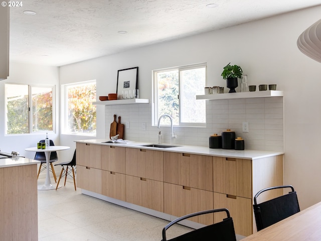 kitchen with decorative backsplash and sink