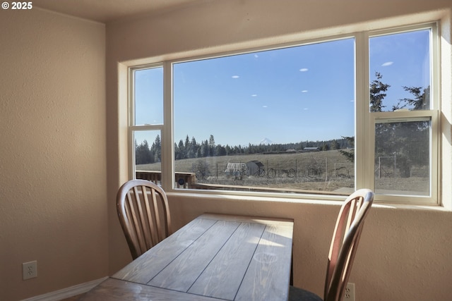 dining space with a rural view