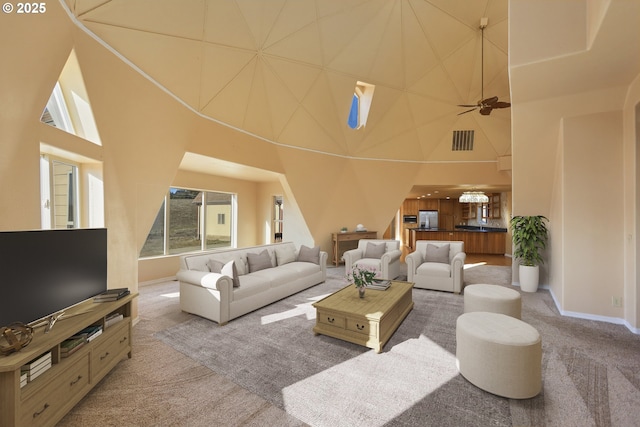 living room featuring a high ceiling and carpet