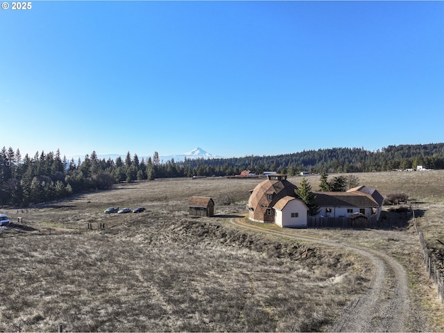 bird's eye view featuring a rural view and a wooded view