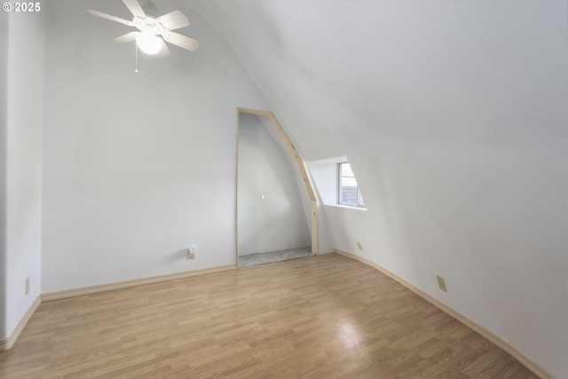 bonus room featuring ceiling fan, vaulted ceiling, and light wood-type flooring