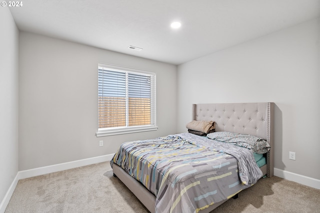 bedroom with light carpet