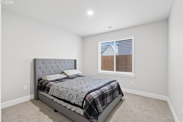 bedroom with light carpet