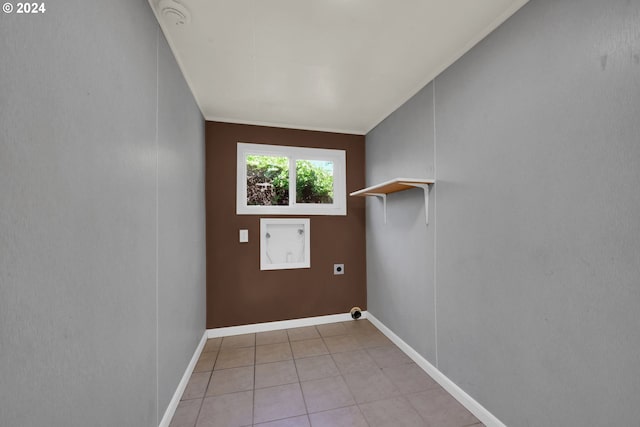 interior space with hookup for a washing machine, light tile patterned floors, and hookup for an electric dryer