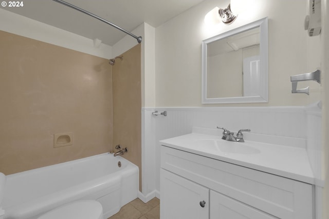 full bathroom with tile patterned flooring, vanity, toilet, and  shower combination