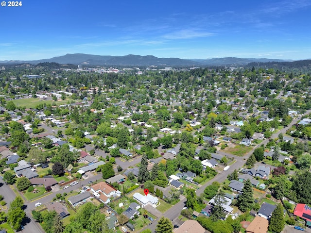 birds eye view of property featuring a mountain view