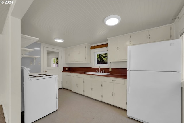 kitchen with white cabinetry, white appliances, and sink