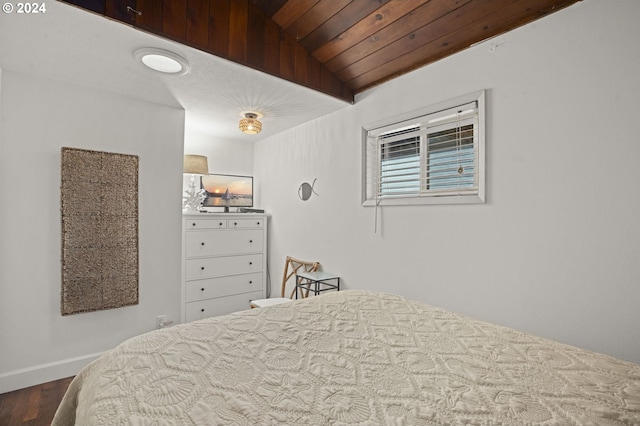 bedroom with wooden ceiling, hardwood / wood-style flooring, and vaulted ceiling