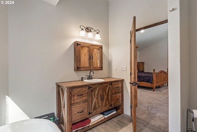 bathroom with vanity and hardwood / wood-style floors