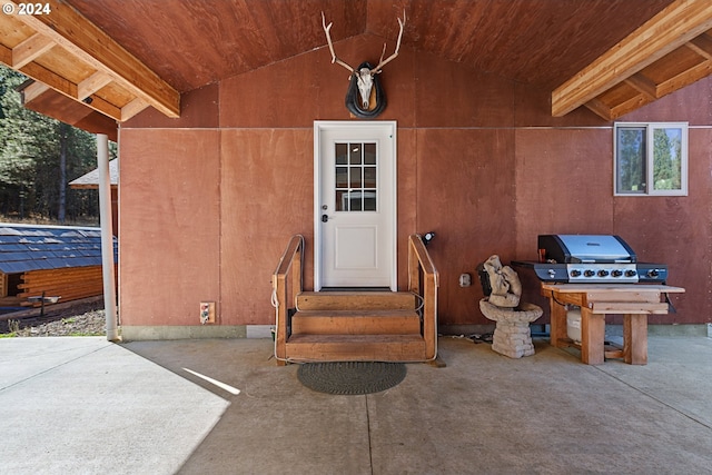 entrance to property featuring a patio